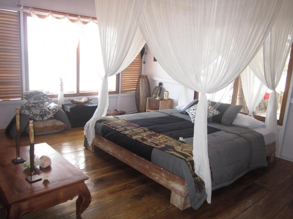 Cemara Beachfront Suite Mondu Szoba fotó